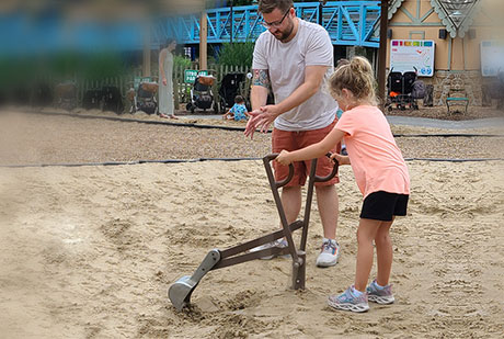 Girl digging in sand